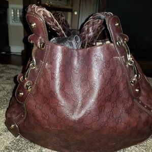 Maroon leather Gucci bag.